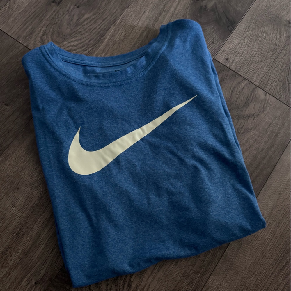 Nike blue dri-fit shirt with white Swoosh
